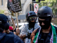 Thousands are marching outside the DNC in Chicago, Illinois, on August 19, 2024, to protest the war on Gaza. At the end of the march, a grou...