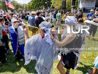 Thousands are marching outside the DNC in Chicago, Illinois, on August 19, 2024, to protest the war on Gaza. At the end of the march, a grou...