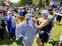 Thousands are marching outside the DNC in Chicago, Illinois, on August 19, 2024, to protest the war on Gaza. At the end of the march, a grou...