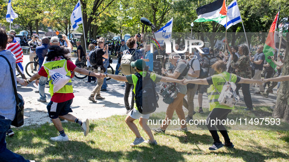 Thousands are marching outside the DNC in Chicago, Illinois, on August 19, 2024, to protest the war on Gaza. At the end of the march, a grou...