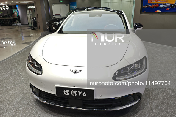 A new energy vehicle is displayed at a Yuanhang auto shop in Shanghai, China, on August 21, 2024. 