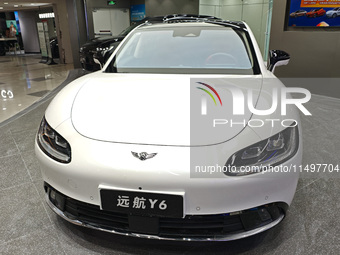 A new energy vehicle is displayed at a Yuanhang auto shop in Shanghai, China, on August 21, 2024. (