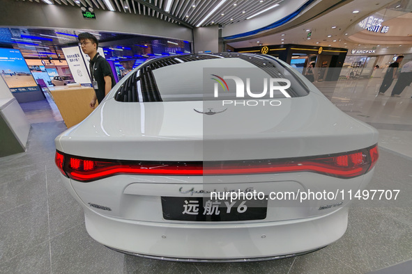 A new energy vehicle is displayed at a Yuanhang auto shop in Shanghai, China, on August 21, 2024. 