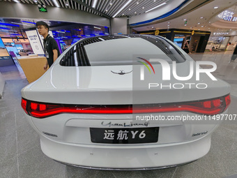 A new energy vehicle is displayed at a Yuanhang auto shop in Shanghai, China, on August 21, 2024. (