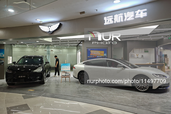 A new energy vehicle is displayed at a Yuanhang auto shop in Shanghai, China, on August 21, 2024. 