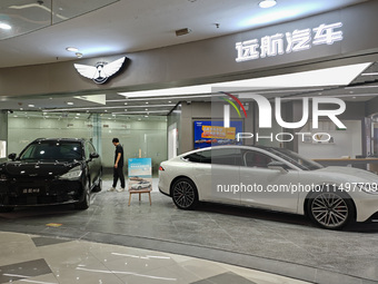 A new energy vehicle is displayed at a Yuanhang auto shop in Shanghai, China, on August 21, 2024. (