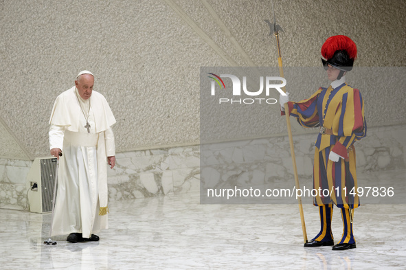 Pope Francis arrives for the weekly general audience in The Vatican, on August 21, 2024, at Paul-VI hall. 