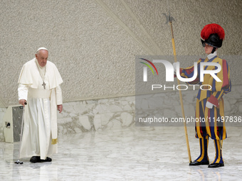 Pope Francis arrives for the weekly general audience in The Vatican, on August 21, 2024, at Paul-VI hall. (