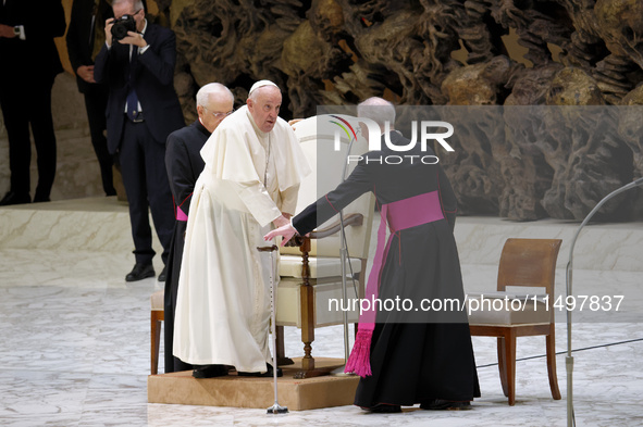 Pope Francis arrives for the weekly general audience in The Vatican, on August 21, 2024, at Paul-VI hall. 