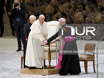 Pope Francis arrives for the weekly general audience in The Vatican, on August 21, 2024, at Paul-VI hall. (