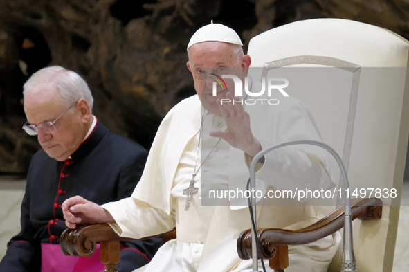 Pope Francis arrives for the weekly general audience in The Vatican, on August 21, 2024, at Paul-VI hall. 