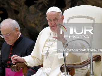 Pope Francis arrives for the weekly general audience in The Vatican, on August 21, 2024, at Paul-VI hall. (