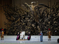 Pope Francis delivers his message during the weekly general audience at the Vatican, on August 21, 2024. (