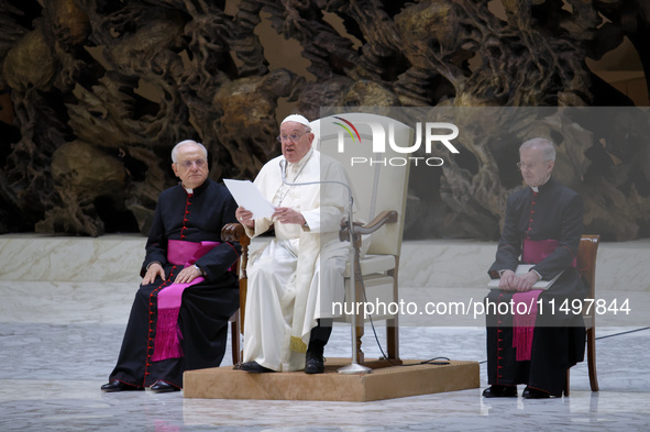 Pope Francis delivers his message during the weekly general audience at the Vatican, on August 21, 2024. 