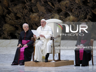 Pope Francis delivers his message during the weekly general audience at the Vatican, on August 21, 2024. (