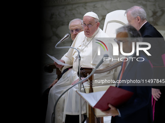 Pope Francis delivers his message during the weekly general audience at the Vatican, on August 21, 2024. (