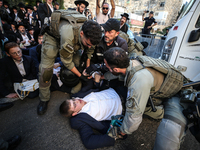 Israeli police officers intervene in Ultra-Orthodox Jews, also known as Haredim, who gather to stage a protest against mandatory military se...