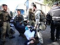 Israeli police officers intervene in Ultra-Orthodox Jews, also known as Haredim, who gather to stage a protest against mandatory military se...