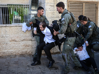 Israeli police officers intervene in Ultra-Orthodox Jews, also known as Haredim, who gather to stage a protest against mandatory military se...