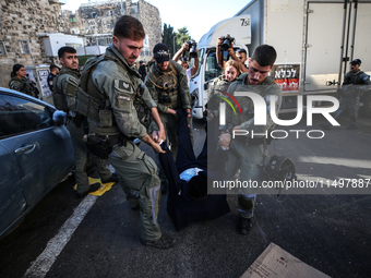 Israeli police officers intervene in Ultra-Orthodox Jews, also known as Haredim, who gather to stage a protest against mandatory military se...