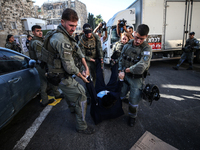 Israeli police officers intervene in Ultra-Orthodox Jews, also known as Haredim, who gather to stage a protest against mandatory military se...