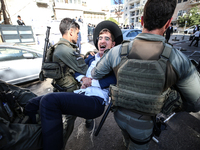 Israeli police officers intervene in Ultra-Orthodox Jews, also known as Haredim, who gather to stage a protest against mandatory military se...