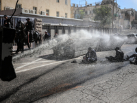 Israeli police officers intervene in Ultra-Orthodox Jews, also known as Haredim, who gather to stage a protest against mandatory military se...