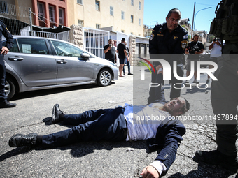 Israeli police officers intervene in Ultra-Orthodox Jews, also known as Haredim, who gather to stage a protest against mandatory military se...