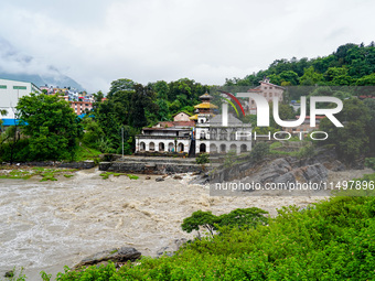 Bagmati River floods and affects riverbanks during heavy rainfall in Kathmandu, Nepal, on August 21, 2024 (