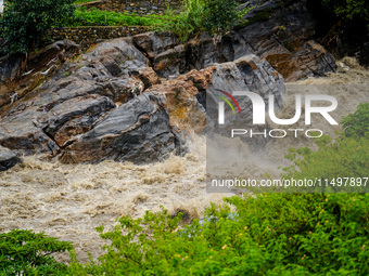 Bagmati River floods and affects riverbanks during heavy rainfall in Kathmandu, Nepal, on August 21, 2024 (