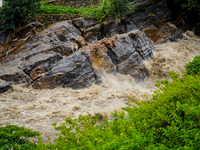 Bagmati River floods and affects riverbanks during heavy rainfall in Kathmandu, Nepal, on August 21, 2024 (