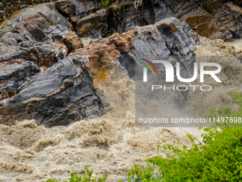 Bagmati River floods and affects riverbanks during heavy rainfall in Kathmandu, Nepal, on August 21, 2024 (