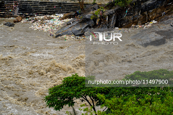 Bagmati River floods and affects riverbanks during heavy rainfall in Kathmandu, Nepal, on August 21, 2024 