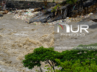 Bagmati River floods and affects riverbanks during heavy rainfall in Kathmandu, Nepal, on August 21, 2024 (