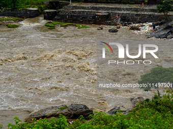 Bagmati River floods and affects riverbanks during heavy rainfall in Kathmandu, Nepal, on August 21, 2024 (