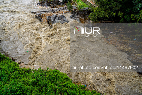 Bagmati River floods and affects riverbanks during heavy rainfall in Kathmandu, Nepal, on August 21, 2024 