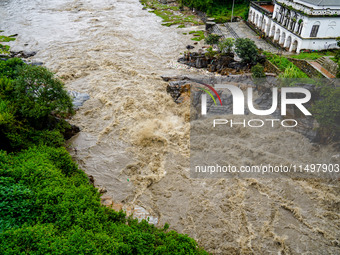 Bagmati River floods and affects riverbanks during heavy rainfall in Kathmandu, Nepal, on August 21, 2024 (