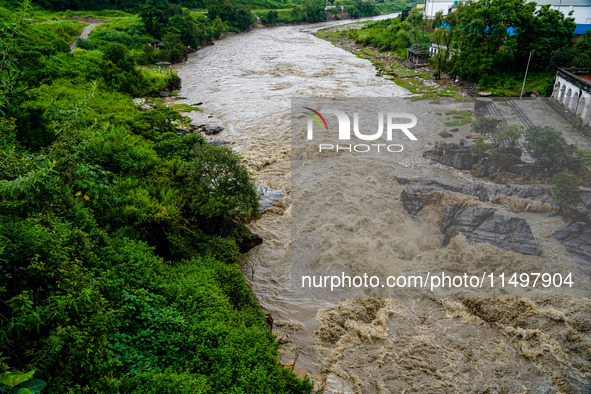 Bagmati River floods and affects riverbanks during heavy rainfall in Kathmandu, Nepal, on August 21, 2024 