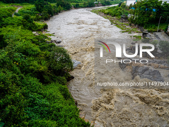 Bagmati River floods and affects riverbanks during heavy rainfall in Kathmandu, Nepal, on August 21, 2024 (