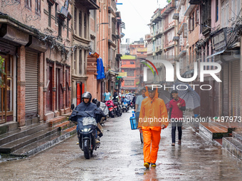 People's daily lives are affected by the heavy rainfall in Kathmandu, Nepal, on August 21, 2024. (