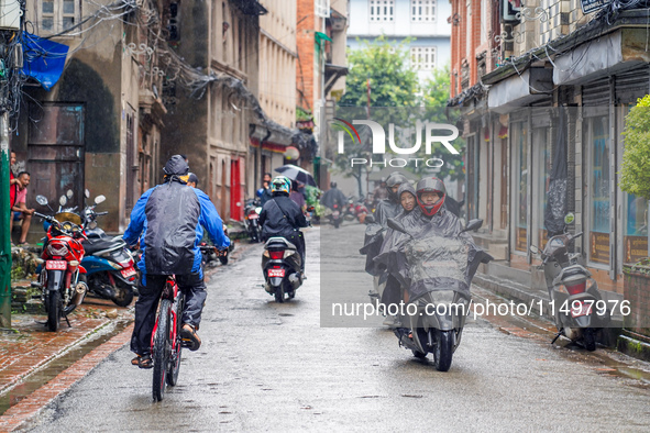 People's daily lives are affected by the heavy rainfall in Kathmandu, Nepal, on August 21, 2024. 