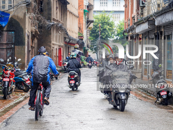 People's daily lives are affected by the heavy rainfall in Kathmandu, Nepal, on August 21, 2024. (