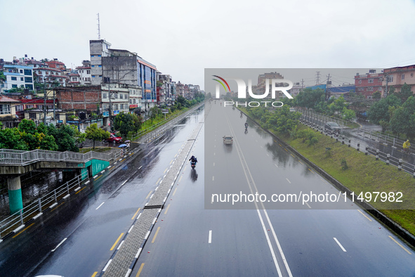 People's daily lives are affected by the heavy rainfall in Kathmandu, Nepal, on August 21, 2024. 