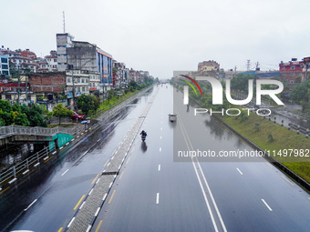 People's daily lives are affected by the heavy rainfall in Kathmandu, Nepal, on August 21, 2024. (