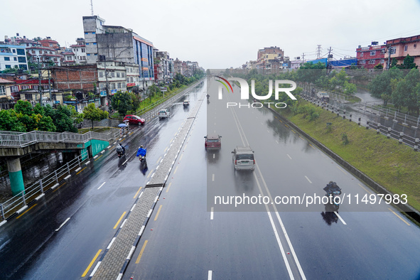 People's daily lives are affected by the heavy rainfall in Kathmandu, Nepal, on August 21, 2024. 