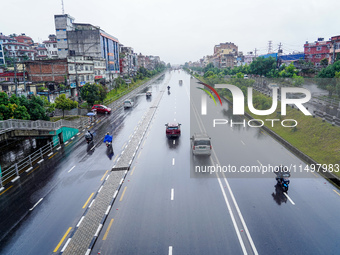 People's daily lives are affected by the heavy rainfall in Kathmandu, Nepal, on August 21, 2024. (