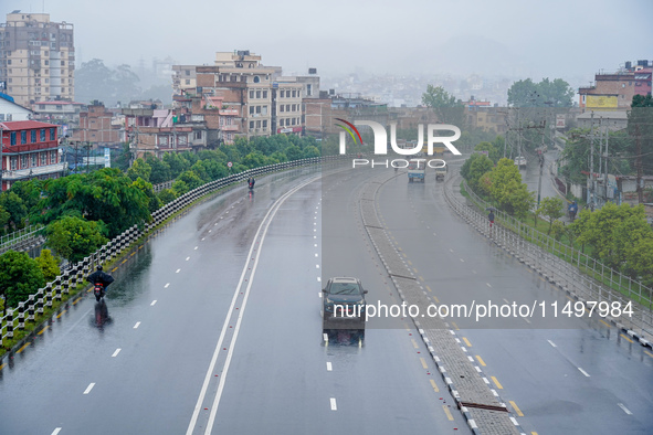 People's daily lives are affected by the heavy rainfall in Kathmandu, Nepal, on August 21, 2024. 