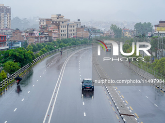 People's daily lives are affected by the heavy rainfall in Kathmandu, Nepal, on August 21, 2024. (