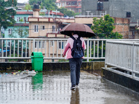 People's daily lives are affected by the heavy rainfall in Kathmandu, Nepal, on August 21, 2024. (