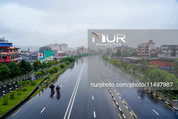 People's daily lives are affected by the heavy rainfall in Kathmandu, Nepal, on August 21, 2024. 